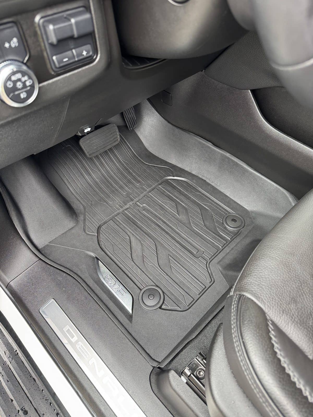 Cleaned front footwell and molded floor mats of a truck.